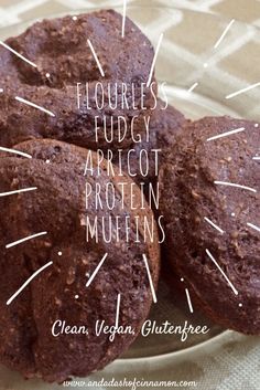 three chocolate muffins on a plate with the words flourless, fudgy, apricot, protein muffins