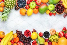 various fruits and vegetables are arranged in the shape of a rectangle on a white background