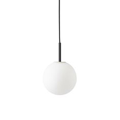 a white ball hanging from a black cord on a light fixture that is suspended above it