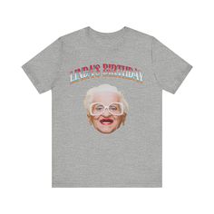 a grey t - shirt with the words linda's birthday on it and an image of