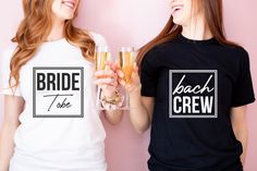 two women are holding champagne glasses with the bride and groom t - shirts on them