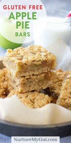 gluten free apple pie bars stacked on top of each other in front of a glass of milk