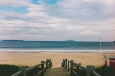 a wooden walkway leading to the beach