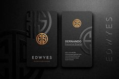 two black and gold business cards with the initials ewwess on each one