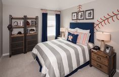 a baseball themed bedroom is shown in this image