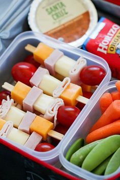 two plastic containers filled with different types of food and veggies next to each other