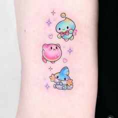 this is an image of some tattoos on someone's arm that are cute and colorful