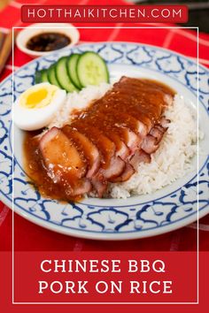 chinese bbq pork on rice with an egg and cucumber