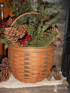 a basket filled with pine cones and evergreen needles