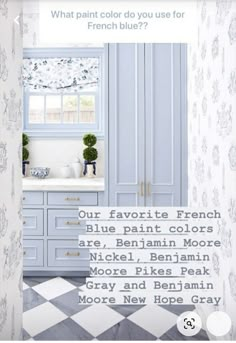 a bathroom with blue cabinets and white walls