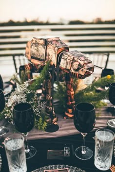 a star wars themed table setting with glasses and plates