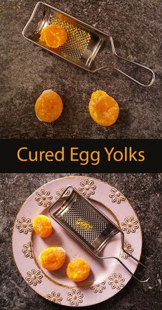 an egg yolk is sitting on a plate next to a grater