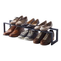 six pairs of shoes are lined up on a rack