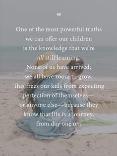 a woman sitting on top of a sandy beach next to the ocean with a poem written in