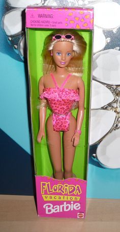 a barbie doll in a pink swimsuit with sunglasses on it's head and body