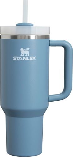 the stanley travel mug is light blue and has a straw in it's cup