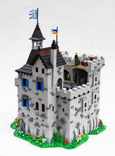 a castle made out of legos on a white background