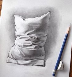 a pencil drawing of a pillow on paper