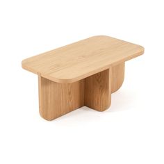 a small wooden table sitting on top of a white floor with no one around it