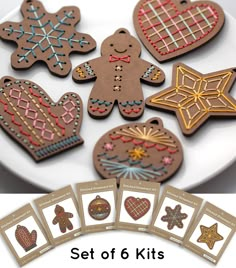 a white plate topped with lots of cut out gingerbreads and other cookies next to each other