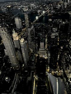 an aerial view of new york city at night from the top of the empire building