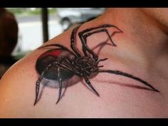 a man with a spider tattoo on his chest