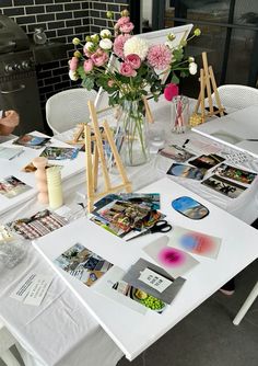 a table with flowers and pictures on it