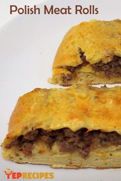 two pieces of meat and cheese pastry on a white plate with the words polish meat rolls