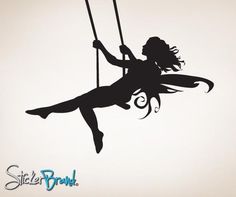 a silhouette of a girl on a swing