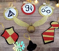 christmas ornaments are arranged on a wooden table