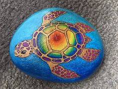 a painted rock with a turtle on it