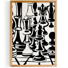 black and white chess pieces are displayed in a wooden framed art print on the wall