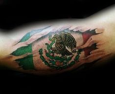 a man's arm with an eagle and mexican flag tattoo on his left shoulder