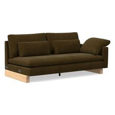 a brown couch sitting on top of a wooden frame