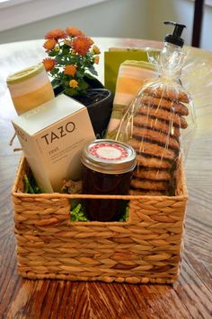 a basket filled with cookies and jam on top of a table