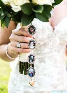 a woman holding a bouquet of flowers with pictures attached to it's wrist and wearing an engagement ring