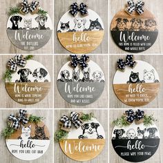 wooden welcome signs with black and white bows are arranged on a wood background, including the words welcome