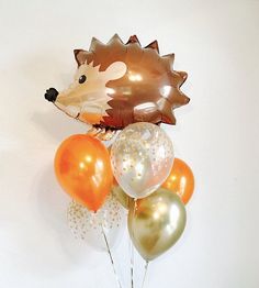 a hedgehog balloon bouquet with balloons in it