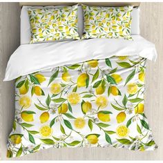 a bed with lemons and leaves on it