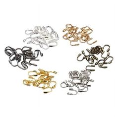 several different types of paper clips on a white background