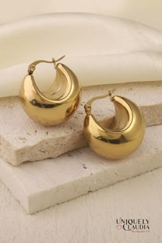 Fall in love with these Chunky Hoop Stainless Steel Earrings. The chunky look adds a fun flare to any look. Plus, no need to worry about getting them wet - they're waterproof! 1.25" Diameter 18K Gold Plated Stainless Steel Closing: Push Back Post Length: 0.8" Width: 0.5" It comes with a cleaning cloth and storage bag Care instructions: To preserve its shine and quality, keep your jewelry dry. Stainless Steel Texture, Gold Round Earrings, Water Drop Earrings, Chunky Hoop Earrings, Chunky Earrings, Steel Earrings, Earring Sale, Gold Drop Earrings, Stainless Steel Earrings