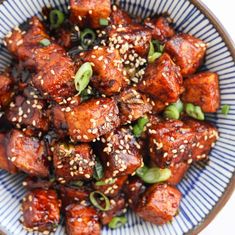 sesame seed tofu in a blue and white bowl