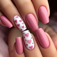 Adorable pink nails with cute heart accents; are perfect for expressing love and adding a playful twist to your manicure. Save this pin for the sweetest nail inspiration you'll love to recreate! 💖✨ Light Pink Nails With White Heart, Valentine Pink Nails, Pink Nails With White Heart On Ring Finger, Pink Base Valentines Nails, Pale Pink Nails With Heart, Nails With Heart Designs, Pink Nails Hearts Valentines Day, Nail Deaigns, Hearts Nail Art