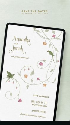 an elegant wedding card with flowers on it