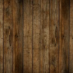 an old wooden wall with planks in the middle and brown paint on it's sides