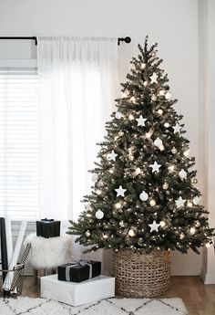 a christmas tree with white lights in a room