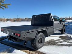 the truck is parked on the side of the road covered in snow and ice,