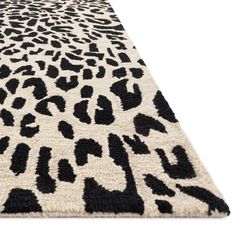 a black and white rug with an animal print pattern