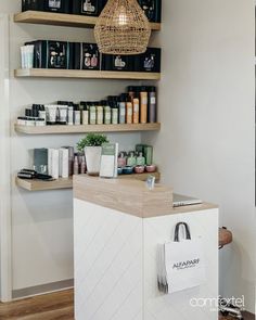 a store with shelves filled with cosmetics and personal care items on it's sides