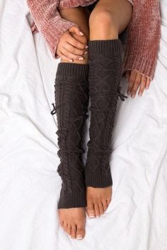 Long cable knit tie leg warmers. These yummy, thick-knitted leg warmers are perfect for everything from lounging by the fire on a cozy afternoon to running errands tucked into your new boots. DETAILS: Cable Knit Pattern One Size fits most Removable Ties Leg Warmer Measures Approximately 25" Cozy Thigh High Cable Knit Leg Warmers, Cozy Cable Knit Socks One Size, One Size Cozy Cable Knit Socks, Cozy One Size Cable Knit Socks, Comfortable Thigh-high Leg Warmers For Fall, Comfortable Thigh High Leg Warmers For Fall, Comfortable Cozy Leg Warmers, Knee-high Cable Knit Winter Socks, Cozy Cable Knit Socks For Winter